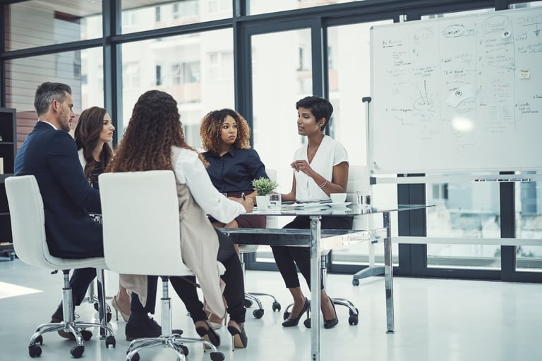 Shot of a group of colleagues having a meeting in a modern office